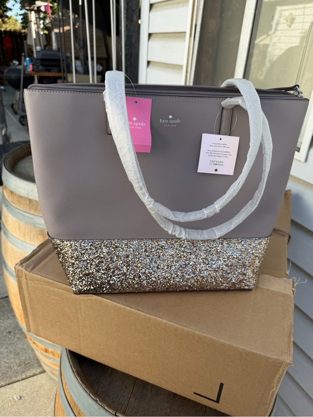 kate spade taupe tote with silver glitter base